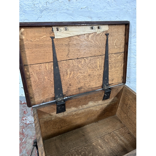 21 - A 19th century oak blanket box with black painted cast iron handles - approx. 32cm high x 63cm wide ... 