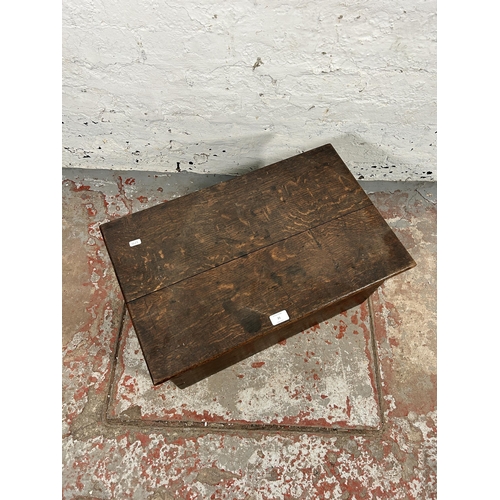 21 - A 19th century oak blanket box with black painted cast iron handles - approx. 32cm high x 63cm wide ... 