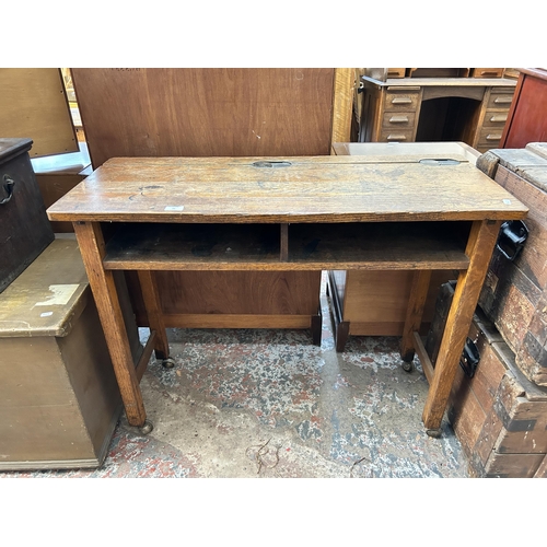 23 - A mid 20th century Kingfisher Ltd West Bromwich oak school desk on castors - approx. 79cm high x 102... 