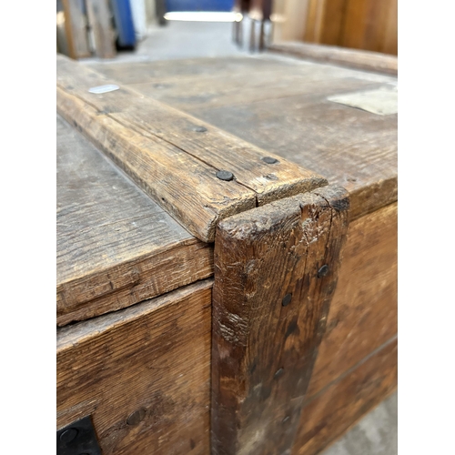 24 - A late 19th/early 20th century pine and metal banded shipping crate - approx. 42cm high x 76cm wide ... 