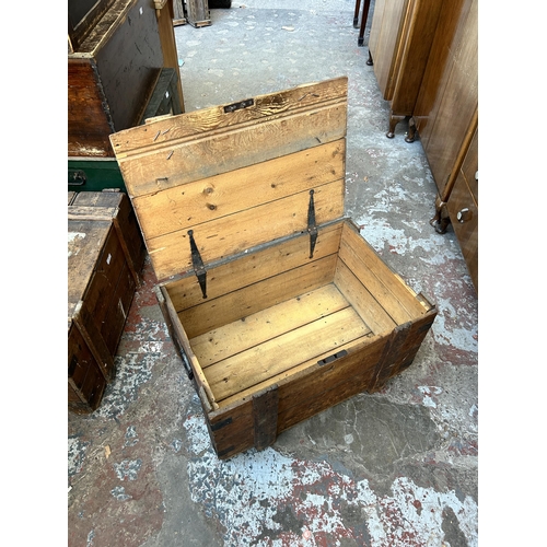 24 - A late 19th/early 20th century pine and metal banded shipping crate - approx. 42cm high x 76cm wide ... 