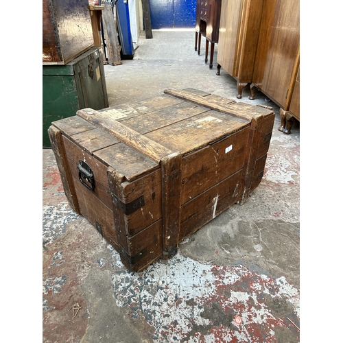 25 - A late 19th/early 20th century pine and metal banded shipping crate - approx. 42cm high x 76cm wide ... 