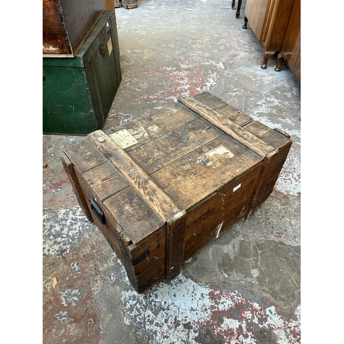 25 - A late 19th/early 20th century pine and metal banded shipping crate - approx. 42cm high x 76cm wide ... 