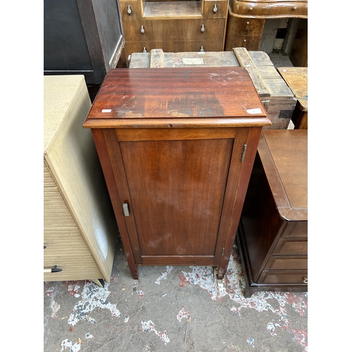 34 - An Edwardian mahogany music cabinet