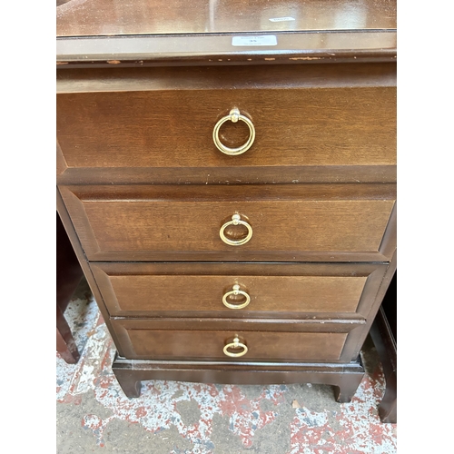 35 - A Stag Minstrel mahogany bedside chest of drawers