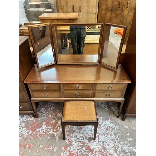 37 - A Stag Minstrel mahogany dressing table and stool