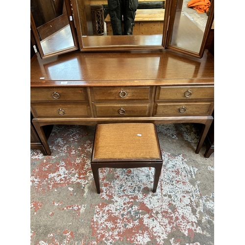 37 - A Stag Minstrel mahogany dressing table and stool