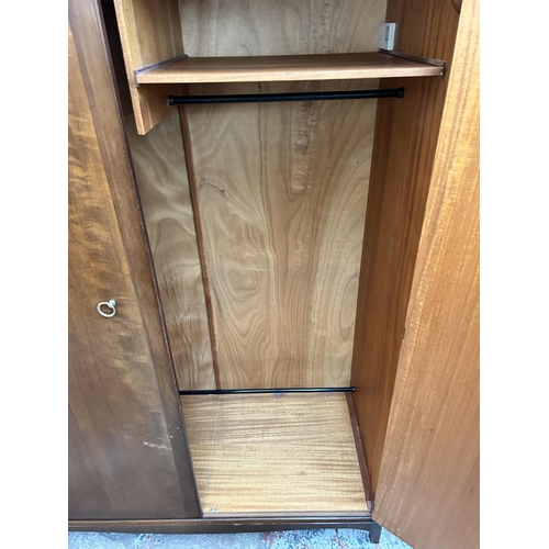 38 - A Stag Minstrel mahogany double wardrobe