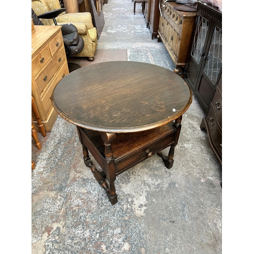 48 - A 17th century style oak monk's seat - approx. 127cm high x 88cm wide x 47cm deep