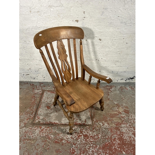 51 - A Victorian elm and beech grandfather chair