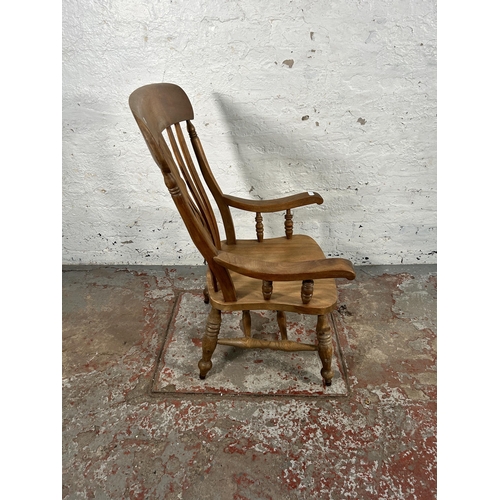 51 - A Victorian elm and beech grandfather chair