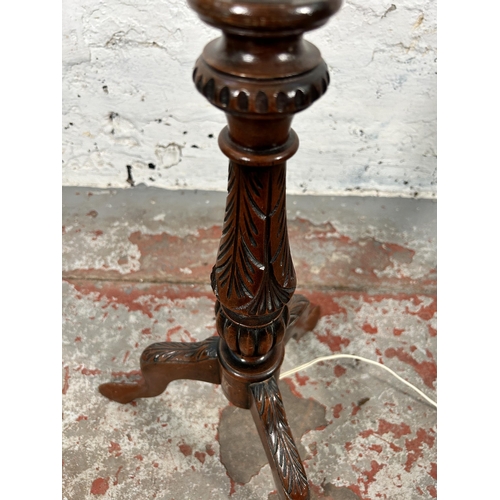 52 - A 19th century style mahogany tripod standard lamp - approx. 138cm high