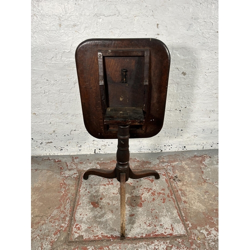 54 - A Georgian oak tilt top tripod occasional table - approx. 106cm high when tilted