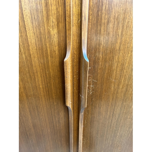 6 - An Austinsuite teak double wardrobe - approx. 174cm high x 121cm wide x 58cm deep