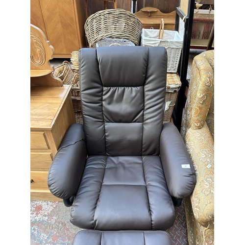 60 - A modern brown leatherette swivel reclining electric massage chair and footstool