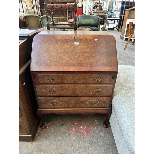 66 - A GB Ltd London mahogany and burr walnut bureau on cabriole supports