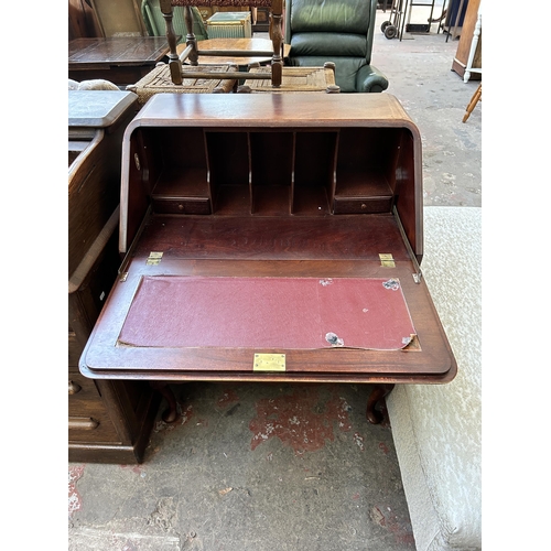 66 - A GB Ltd London mahogany and burr walnut bureau on cabriole supports