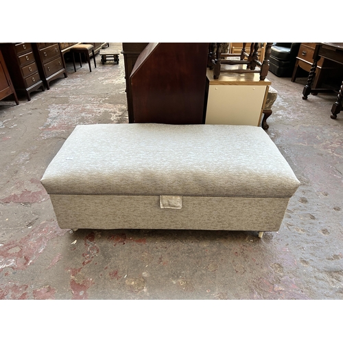 67 - An early 20th century fabric upholstered blanket box on castors - approx. 49cm high x 129cm wide x 6... 