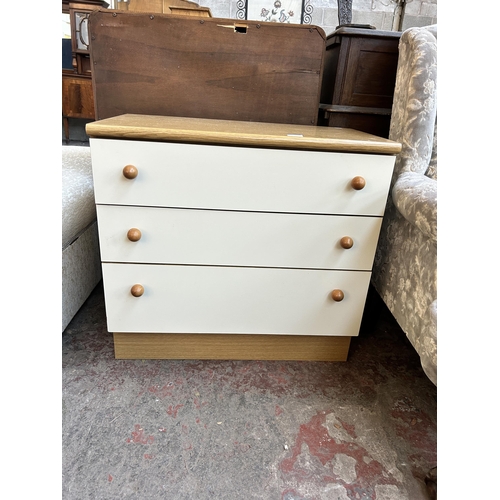 69 - An oak effect and white laminate chest of drawers