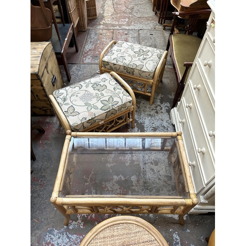 75 - Five pieces of wicker and cane conservatory furniture, two footstools, one coffee table and two circ... 