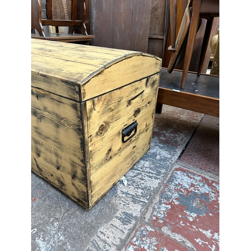 79 - An early 20th century pine dome top blanket box - approx. 60cm high x 84cm wide x 55cm deep