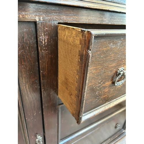 8 - A mid 20th century oak bookcase with three leaded glass doors - approx. 194cm high x 122cm wide x 33... 