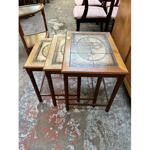 93 - A mid 20th century Mobelfabrikken Toften of Denmark teak and tile top nest of three tables