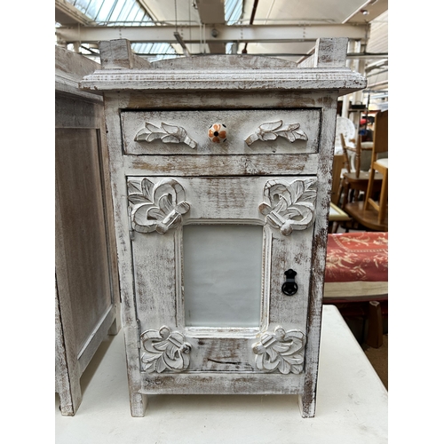 96 - A pair of French style white painted bedside cabinets