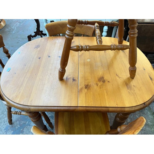 115 - A pine extending dining table and four chairs