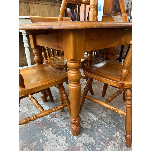 115 - A pine extending dining table and four chairs