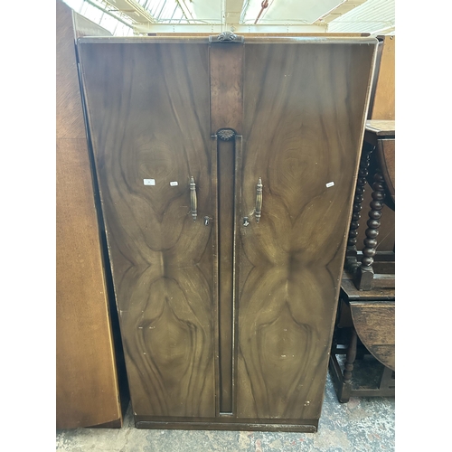 15 - A mid 20th century Butilux walnut double wardrobe