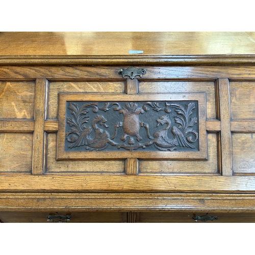 178 - An Edwardian Ralph Johnson Warrington carved oak bureau