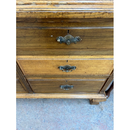 178 - An Edwardian Ralph Johnson Warrington carved oak bureau