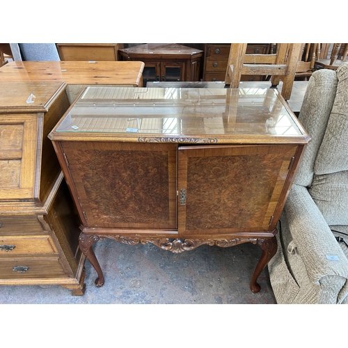 179 - A walnut cocktail cabinet with fitted interior and cabriole supports - approx. 99cm high x 89cm wide... 