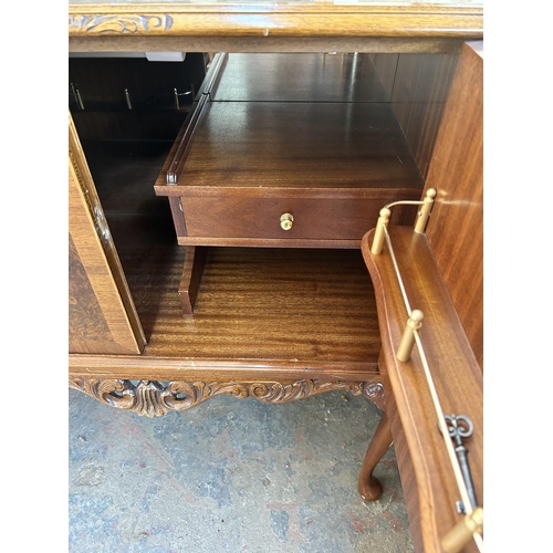 179 - A walnut cocktail cabinet with fitted interior and cabriole supports - approx. 99cm high x 89cm wide... 