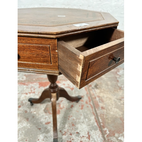 183 - A Regency style mahogany and brown leather drum table