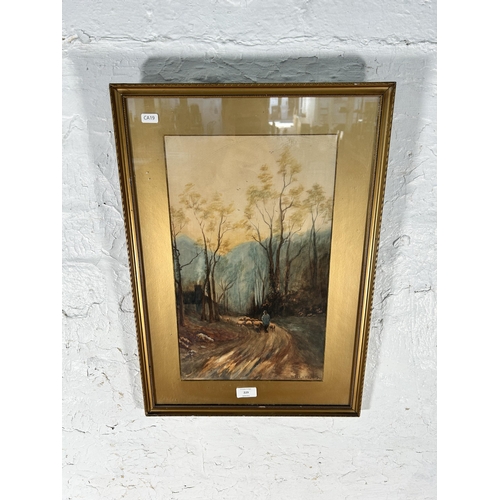 229 - An early 20th century gilt framed D. Lowe farmer and sheep dog scene watercolour, dated 1919 - appro... 