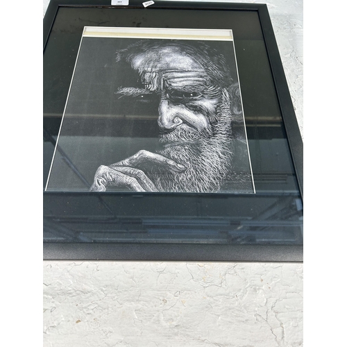 303 - A framed portrait print of an elderly gentleman - approx. 56cm high x 49cm wide