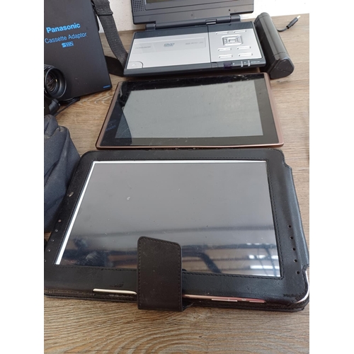 668 - Five items, one cased Samsung GT-N8010 tablet, one Asus TF101 tablet, one cased Panasonic NV-S70B SV... 