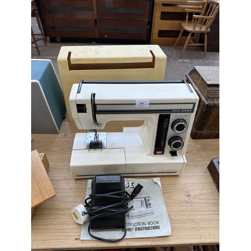 A cased Janome New Home SW2018E electric sewing machine with foot pedal ...