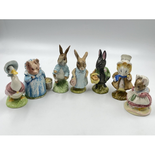 307 - Seven Beatrix Potter figurines, four Royal Albert and three Beswick