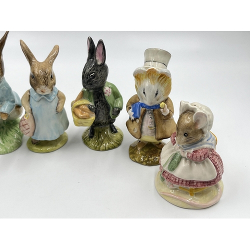 307 - Seven Beatrix Potter figurines, four Royal Albert and three Beswick