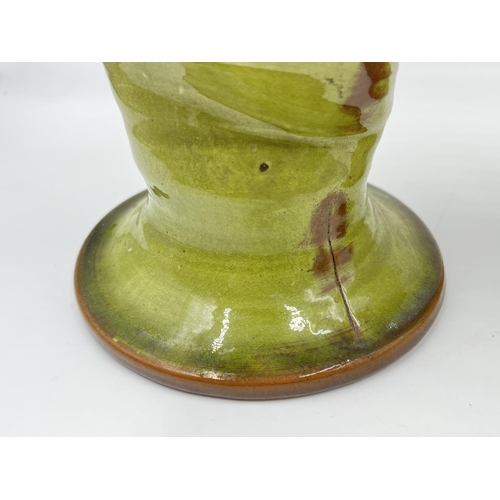 312 - Two studio pottery green glazed vessels - approx. 24cm high