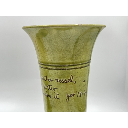 312 - Two studio pottery green glazed vessels - approx. 24cm high