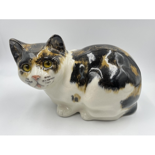 314 - A Winstanley ceramic cat figurine with glass eyes - approx. 17cm high