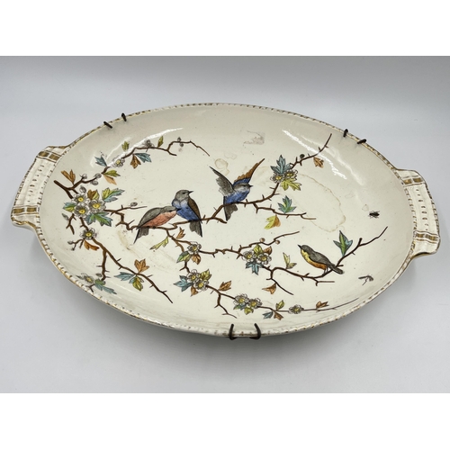 318 - A Franz Anton Melham for Royal Bonn porcelain twin handled oval dish depicting birds - approx. 34cm ... 