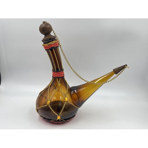 319 - A 1970s Spanish amber glass porron - approx. 30cm high