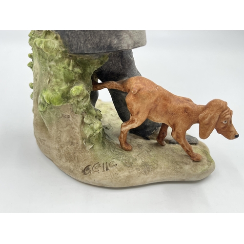 325 - A Capodimonte porcelain figurine of a man and dog by G. Calle - approx. 22cm high