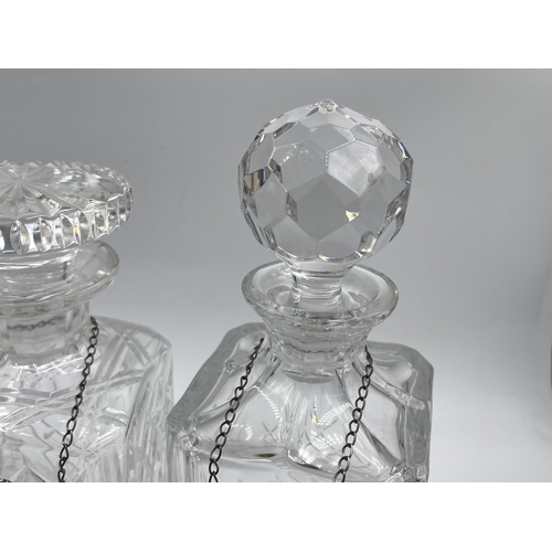 329 - Three crystal glass decanters with three Broadway & Co hallmarked Birmingham silver decanter labels,... 