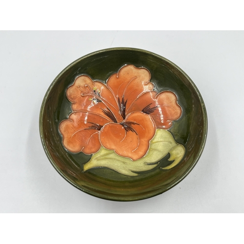 336 - A Moorcroft Coral Hibiscus circular trinket dish - approx. 12cm diameter